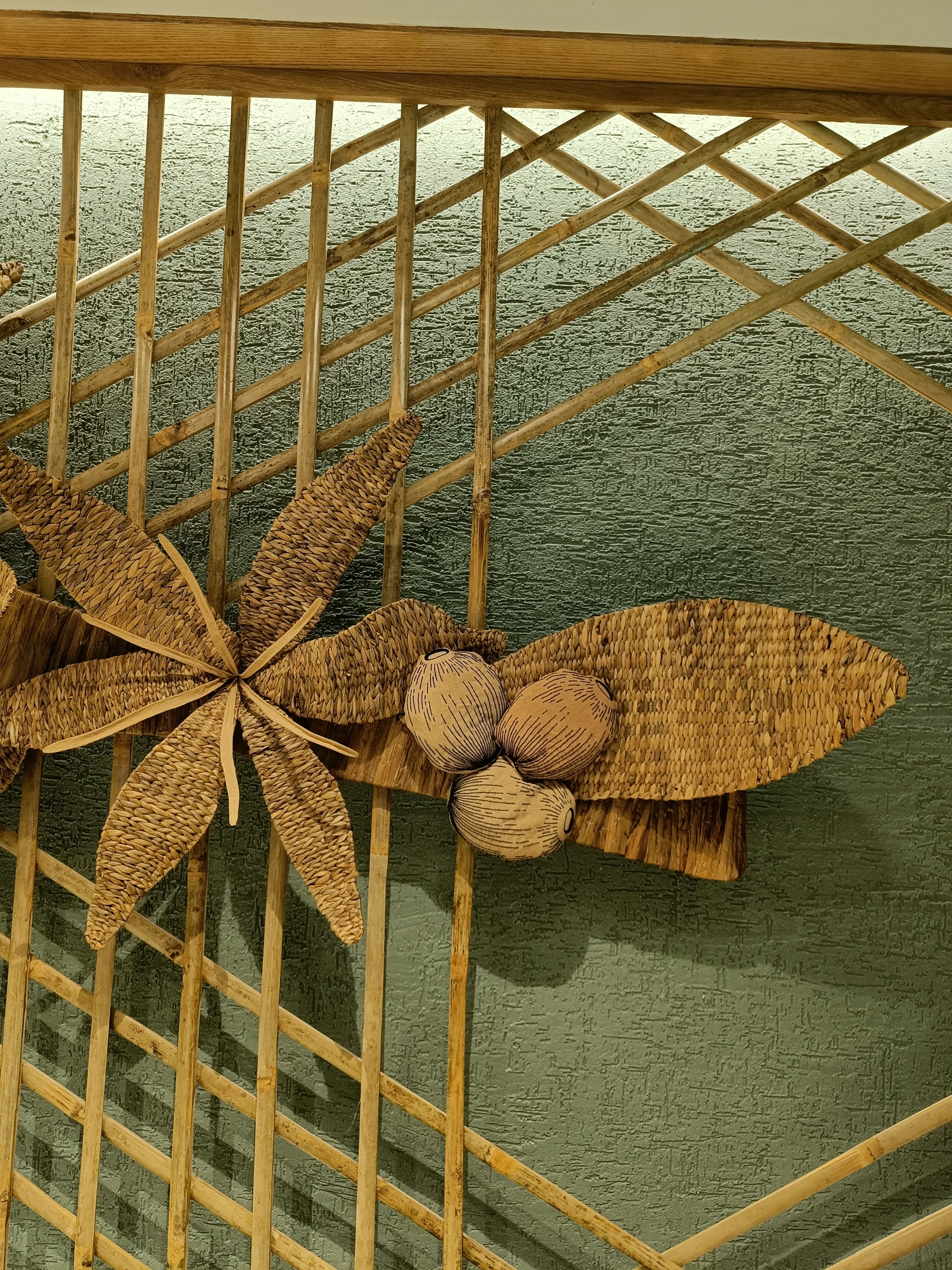 Detail of the cane and meteka coffee-flower weave at Starbucks GS Road, Guwahati